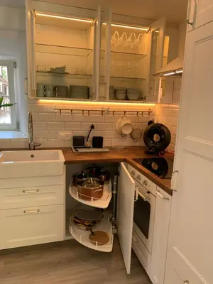 a kitchen with white cabinets and a sink and a counter at Allegra Appenzell in Trogen