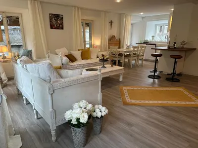 a living room with a couch and a table at Allegra Appenzell in Trogen