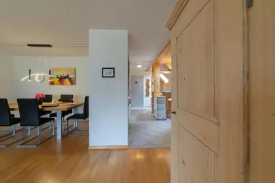 a door leading into a dining room with a table at Vista Montagna in Unterwasser