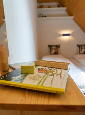 two boxes sitting on top of a wooden table at Vista Montagna in Unterwasser