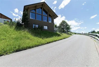 a small building on the side of a road at Primula in Wildhaus