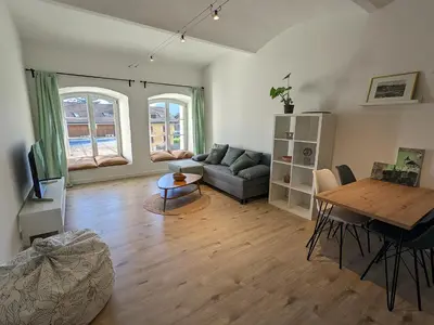 a living room with a couch and a table at Alte Brauerei Buchs in Buchs