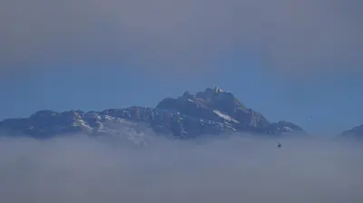 a mountain in the middle of the clouds at Gästehaus Aemisegg in Sankt Peterzell