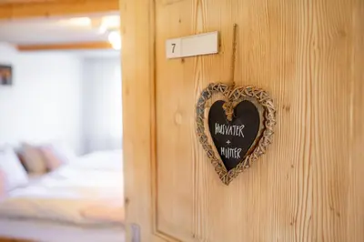 a heart on a wall with a sign on it at Gästehaus Aemisegg in Sankt Peterzell