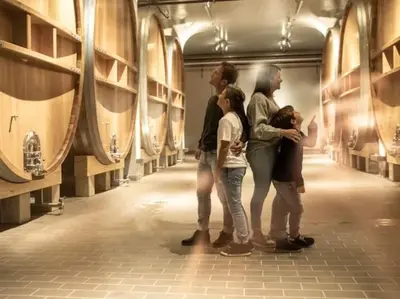 a group of people standing in a wine cellar at Charmante und zentrale Wohnung am Weiherpark Arbon in Arbon