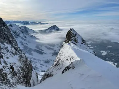 a view of a mountain with snow on it at Blässchopfhüsli in Nesslau