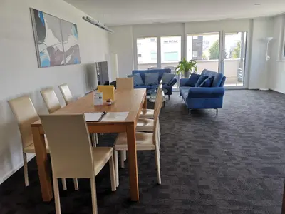 a dining room with a table and chairs at Ferienwohnung Hirschen in Gossau