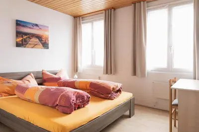 a bedroom with two beds with pillows on it at Landgasthof Adler in 9304 Bernhardzell in Häggenschwil