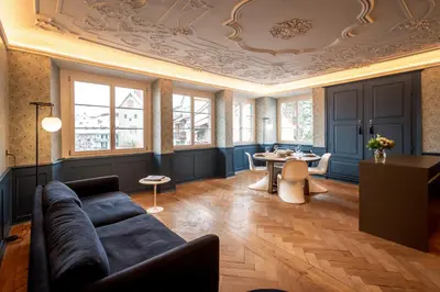 a living room with a couch and a table at JACOB 1808. fine historic town apartments in Bischofszell