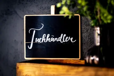 a black chalkboard sign with the word luthinators at JACOB 1808. fine historic town apartments in Bischofszell