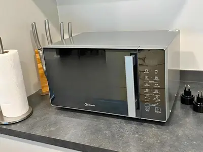 a microwave sitting on top of a counter at Ferienhausträume Oase Bodensee in Kreuzlingen