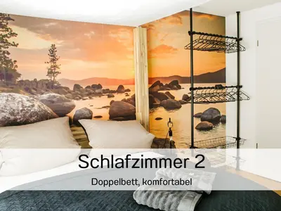 a bedroom with a wall mural of a river at Ferienhausträume Oase Bodensee in Kreuzlingen