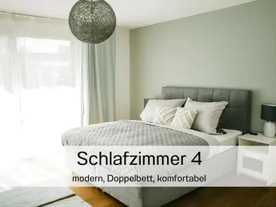 a bedroom with a bed and a window at Ferienhausträume Oase Bodensee in Kreuzlingen